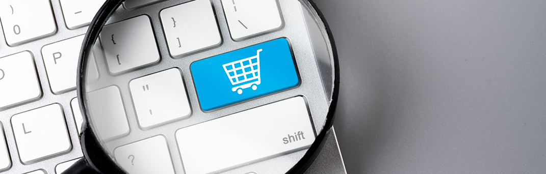 Sistema de pago en línea representado por un teclado con icono de compra